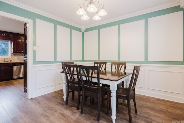 15 Rocky Crest Ct, Little Rock, AR 72211 - dining area featuring a decorative wall, a chandelier, crown molding, and wood finished floors