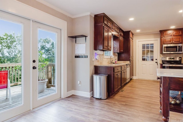 15 Rocky Crest Ct, Little Rock, AR 72211 - kitchen featuring stainless steel appliances, ornamental molding, backsplash, light wood-style flooring, and light stone countertops