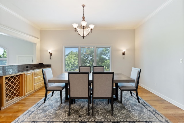 48 Ranch Ridge Rd, Little Rock, AR 72223 - dining area featuring a chandelier, crown molding, and light wood-style floors