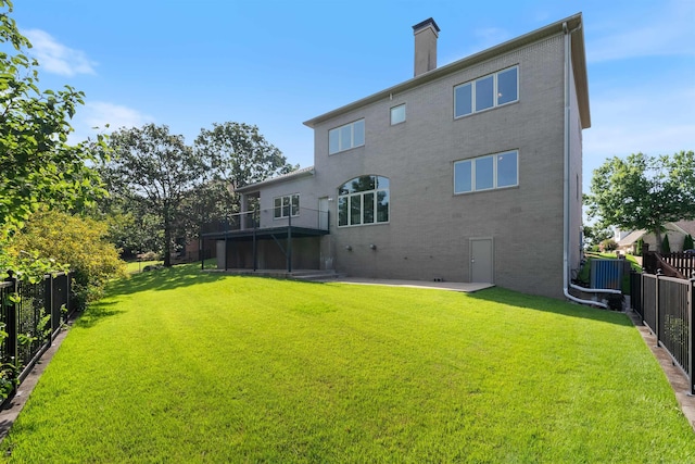 48 Ranch Ridge Rd, Little Rock, AR 72223 - back of property with a fenced backyard, brick siding, a chimney, and a patio