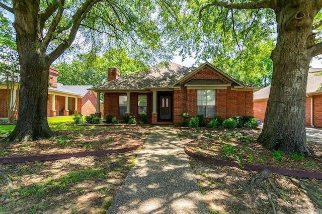 1940 Payne Ln, Conway, AR 72034 - view of front facade featuring a chimney and brick siding