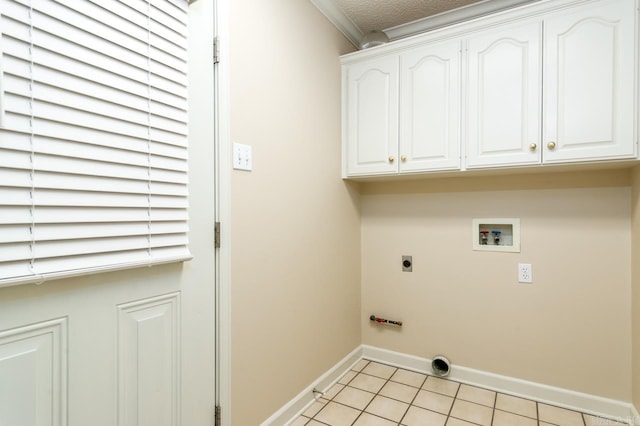 1940 Payne Ln, Conway, AR 72034 - washroom featuring cabinet space, washer hookup, electric dryer hookup, light tile patterned floors, and ornamental molding