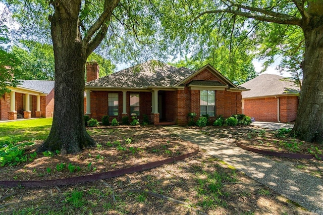 1940 Payne Ln, Conway, AR 72034 - view of front of home with a chimney and brick siding