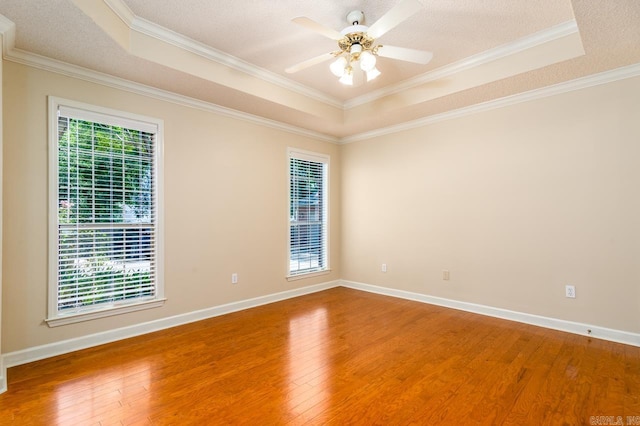 1940 Payne Ln, Conway, AR 72034 - unfurnished room with a raised ceiling, wood finished floors, ornamental molding, and ceiling fan