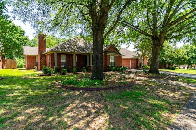 1940 Payne Ln, Conway, AR 72034 - single story home featuring brick siding, a chimney, and a front lawn