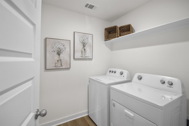 6804 Cypress Trl, North Little Rock, AR 72113 - laundry room with washer and clothes dryer and dark wood-style flooring