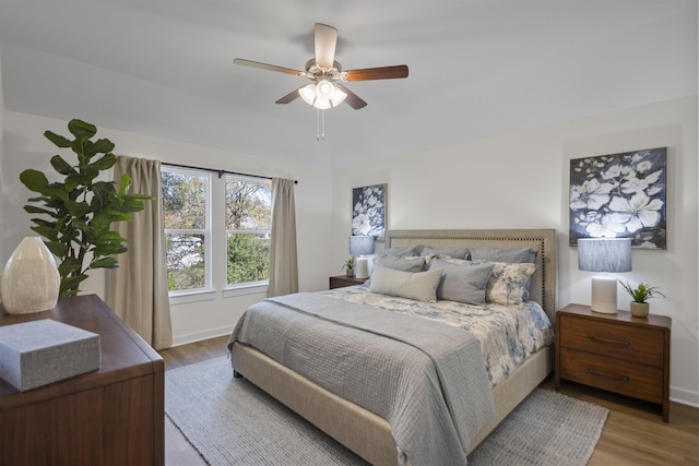 6804 Cypress Trl, North Little Rock, AR 72113 - bedroom with wood finished floors and a ceiling fan