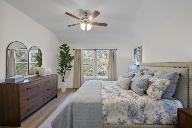 6804 Cypress Trl, North Little Rock, AR 72113 - bedroom with light wood finished floors, lofted ceiling, and ceiling fan