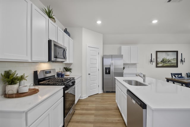 6804 Cypress Trl, North Little Rock, AR 72113 - kitchen with appliances with stainless steel finishes, light countertops, recessed lighting, light wood-type flooring, and tasteful backsplash