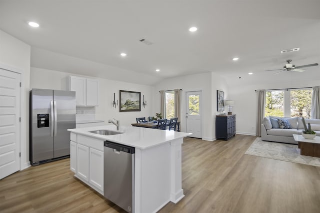 6804 Cypress Trl, North Little Rock, AR 72113 - kitchen with appliances with stainless steel finishes, healthy amount of natural light, open floor plan, white cabinets, and recessed lighting