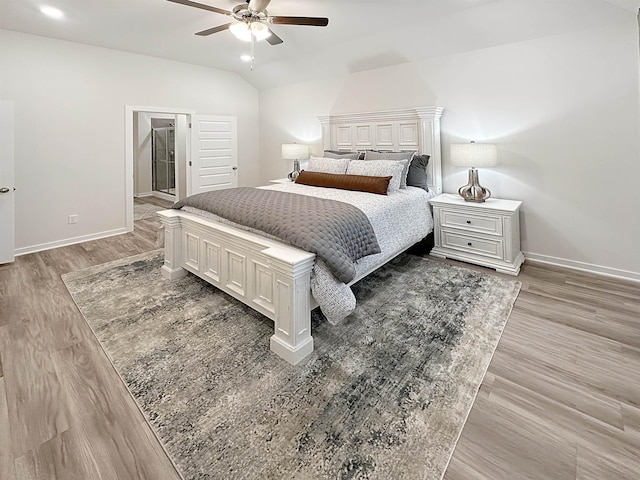 10501 Leyland Rd, North Little Rock, AR 72113 - bedroom featuring light wood-type flooring, vaulted ceiling, and a ceiling fan