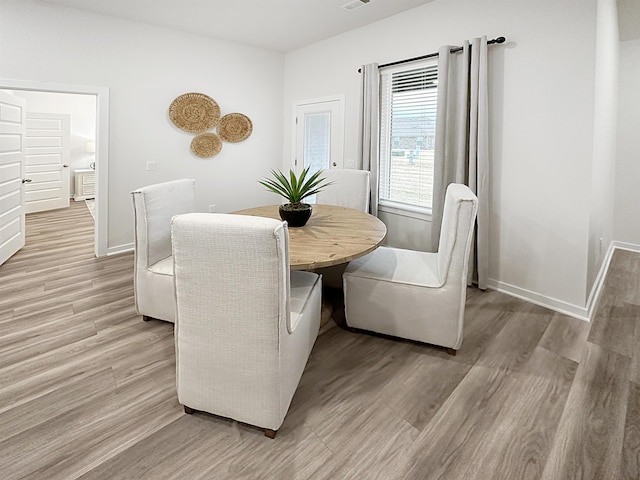 10501 Leyland Rd, North Little Rock, AR 72113 - dining area featuring light wood finished floors