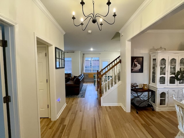 4202 Stephanie, Jonesboro, AR 72401 - entryway with light wood-style floors, stairs, crown molding, and a chandelier