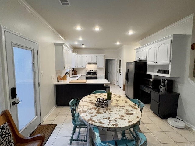 4202 Stephanie, Jonesboro, AR 72401 - kitchen featuring electric stove, light tile patterned flooring, a peninsula, light countertops, and crown molding
