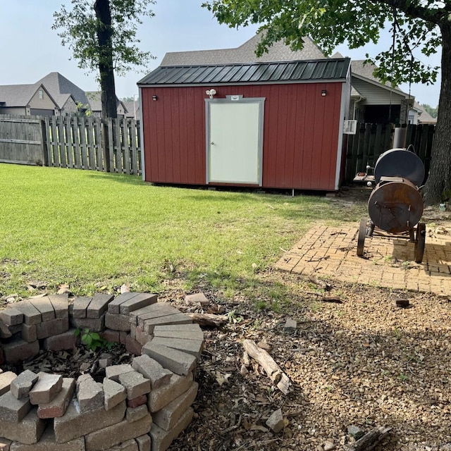 4202 Stephanie, Jonesboro, AR 72401 - fenced backyard featuring a fire pit and a storage unit