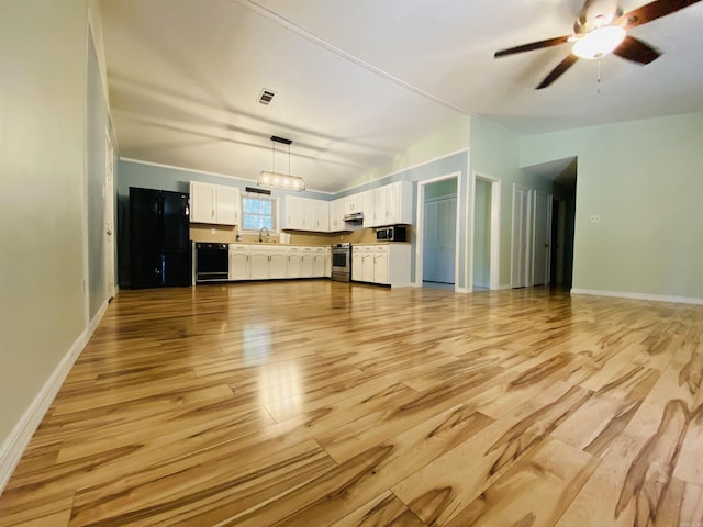 779 Brenda St, Camden, AR 71701 - unfurnished living room with light wood-type flooring, vaulted ceiling, and a ceiling fan
