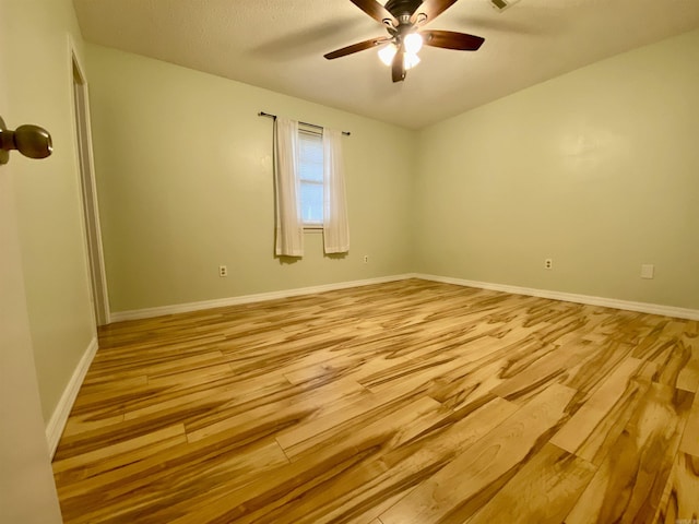 779 Brenda St, Camden, AR 71701 - empty room featuring light wood-style floors and a ceiling fan
