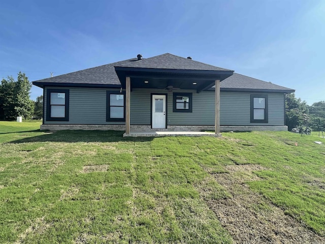 10691 W Miller Sardis, Bauxite, AR 72011 - rear view of property featuring a shingled roof, a yard, and a ceiling fan