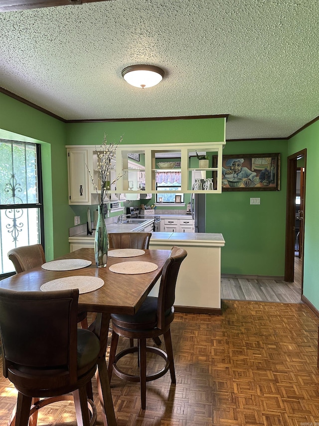 14400 Pikewood Dr, Alexander, AR 72002 - dining area featuring a textured ceiling and crown molding