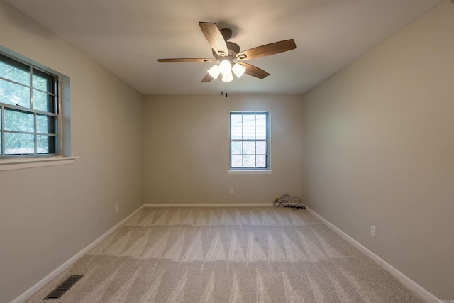 3109 Donaghey Dr, North Little Rock, AR 72116 - spare room featuring light carpet and a ceiling fan