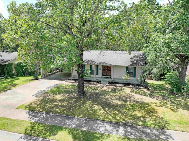 3109 Donaghey Dr, North Little Rock, AR 72116 - view of front facade with concrete driveway, a porch, a carport, a front yard, and a shingled roof