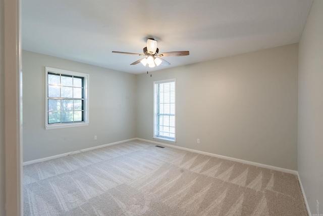 3109 Donaghey Dr, North Little Rock, AR 72116 - spare room featuring plenty of natural light, light carpet, and ceiling fan