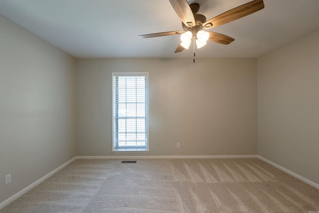 3109 Donaghey Dr, North Little Rock, AR 72116 - spare room featuring plenty of natural light, light colored carpet, and ceiling fan