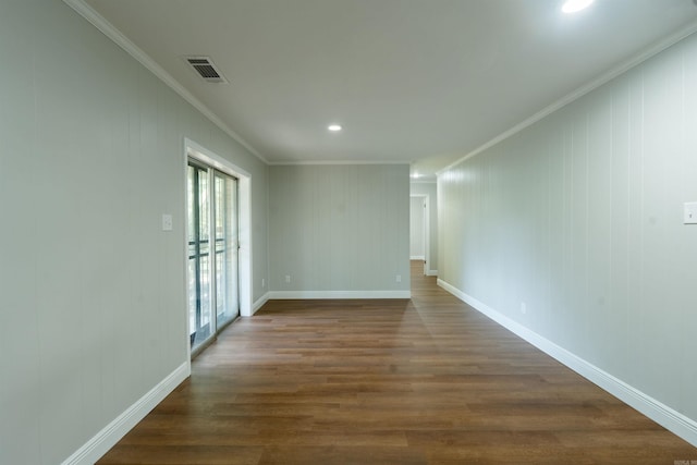 3109 Donaghey Dr, North Little Rock, AR 72116 - empty room featuring crown molding, dark wood finished floors, and recessed lighting