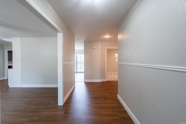 3109 Donaghey Dr, North Little Rock, AR 72116 - corridor featuring dark wood finished floors and baseboards