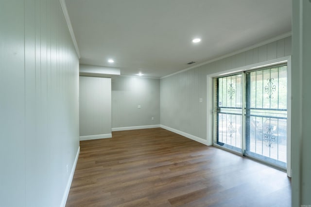3109 Donaghey Dr, North Little Rock, AR 72116 - spare room featuring plenty of natural light, ornamental molding, wood finished floors, and recessed lighting