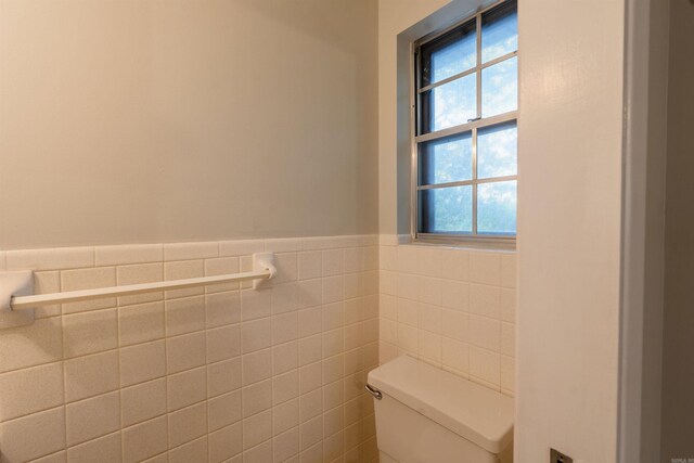 3109 Donaghey Dr, North Little Rock, AR 72116 - bathroom featuring a wainscoted wall and tile walls