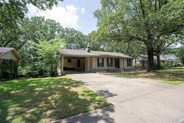 3109 Donaghey Dr, North Little Rock, AR 72116 - single story home with driveway, a chimney, a front yard, and a carport