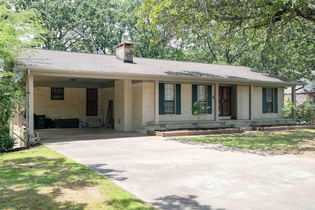 3109 Donaghey Dr, North Little Rock, AR 72116 - single story home featuring driveway, an attached carport, brick siding, and a chimney