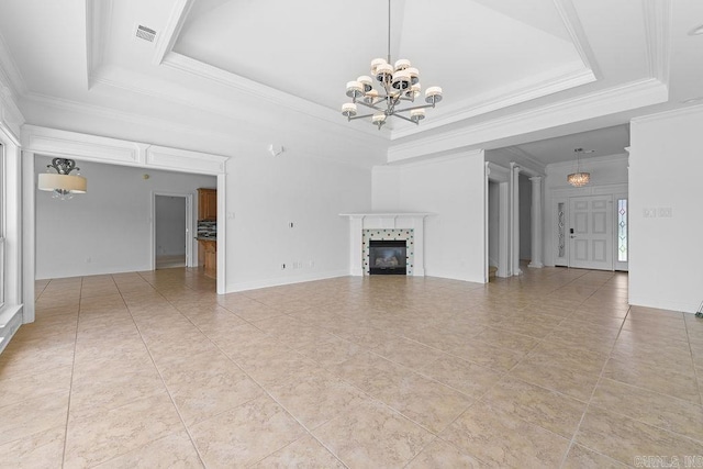 6733 Austin Bay Ct, Sherwood, AR 72120 - unfurnished living room with a chandelier, a tray ceiling, a fireplace, ornamental molding, and light tile patterned flooring