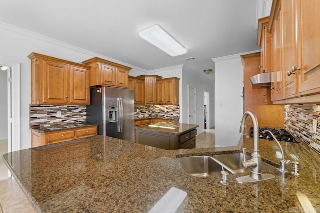 6733 Austin Bay Ct, Sherwood, AR 72120 - kitchen with stainless steel fridge with ice dispenser, backsplash, brown cabinetry, crown molding, and gas cooktop