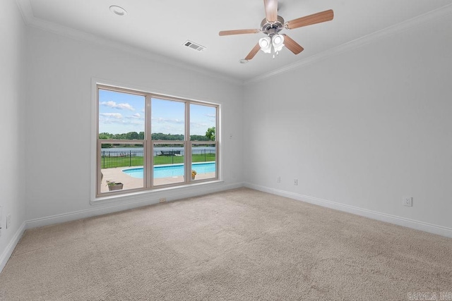 6733 Austin Bay Ct, Sherwood, AR 72120 - spare room featuring crown molding, a ceiling fan, and carpet flooring