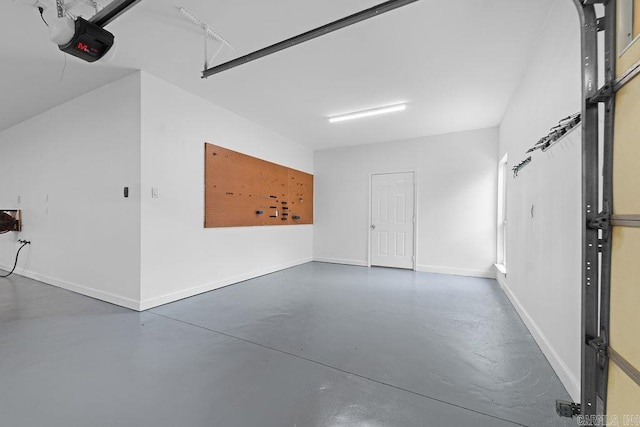 6733 Austin Bay Ct, Sherwood, AR 72120 - garage featuring a garage door opener and baseboards