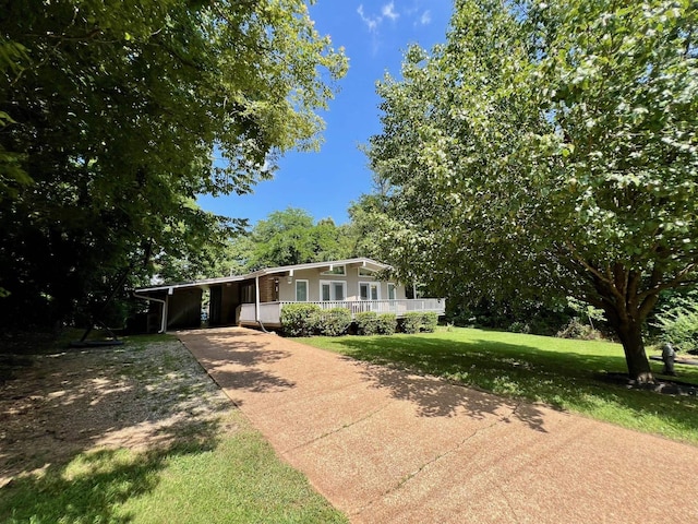 5 Winnebago Cir, Cherokee Village, AR 72529 - view of front of home with concrete driveway, a carport, a front lawn, and a porch