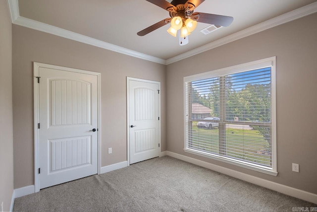 274 Reuben Dr, Alexander, AR 72202 - unfurnished bedroom with crown molding, carpet flooring, multiple closets, and a ceiling fan
