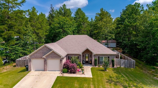 274 Reuben Dr, Alexander, AR 72202 - view of front of home with a garage, brick siding, and driveway