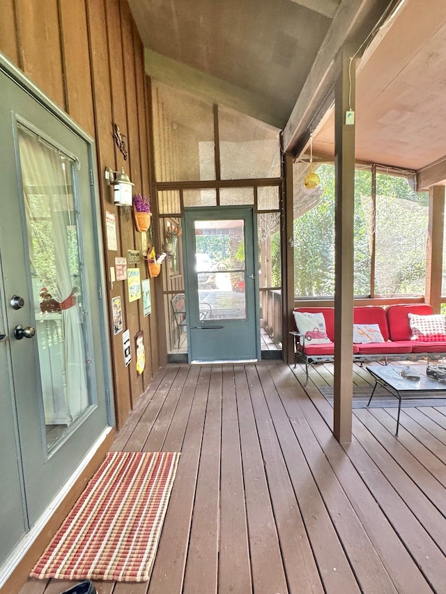 sunroom / solarium with vaulted ceiling
