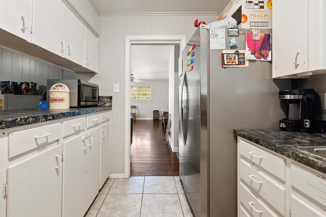 100 E Scenic Dr, North Little Rock, AR 72118 - kitchen with appliances with stainless steel finishes, white cabinetry, a ceiling fan, and light tile patterned floors