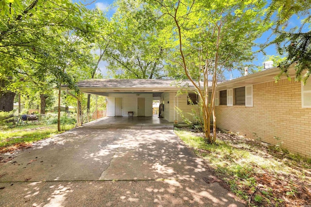 100 E Scenic Dr, North Little Rock, AR 72118 - single story home featuring brick siding, concrete driveway, and a carport