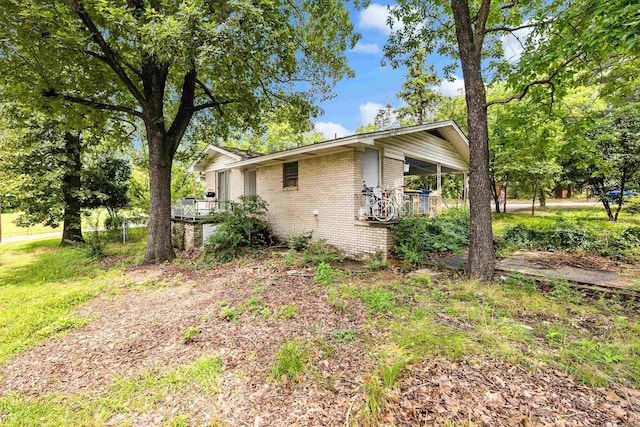 100 E Scenic Dr, North Little Rock, AR 72118 - view of home's exterior featuring brick siding