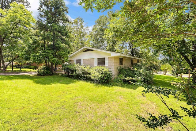 100 E Scenic Dr, North Little Rock, AR 72118 - view of side of home featuring a lawn and brick siding