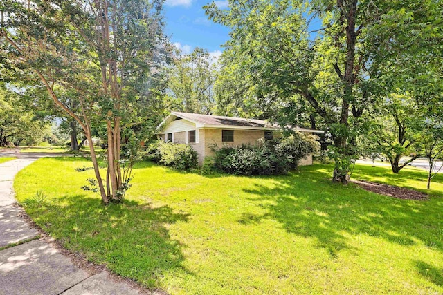 100 E Scenic Dr, North Little Rock, AR 72118 - view of front of home featuring a front yard and brick siding