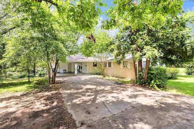 100 E Scenic Dr, North Little Rock, AR 72118 - single story home with driveway, brick siding, and an attached carport