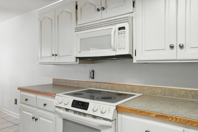 7328 W Ridge Cir, Sherwood, AR 72120 - kitchen with white appliances, white cabinetry, and light tile patterned floors