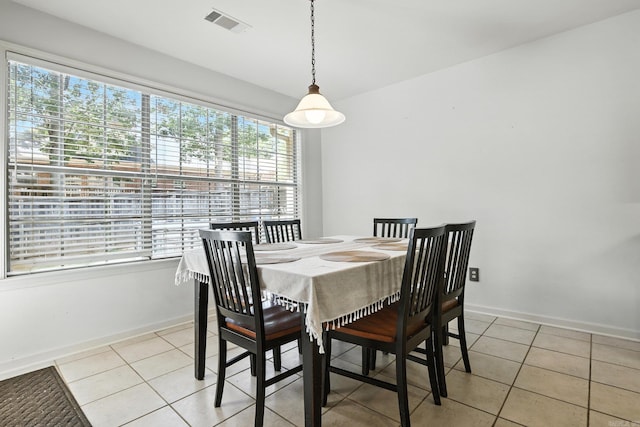 7328 W Ridge Cir, Sherwood, AR 72120 - dining space with healthy amount of natural light and light tile patterned floors