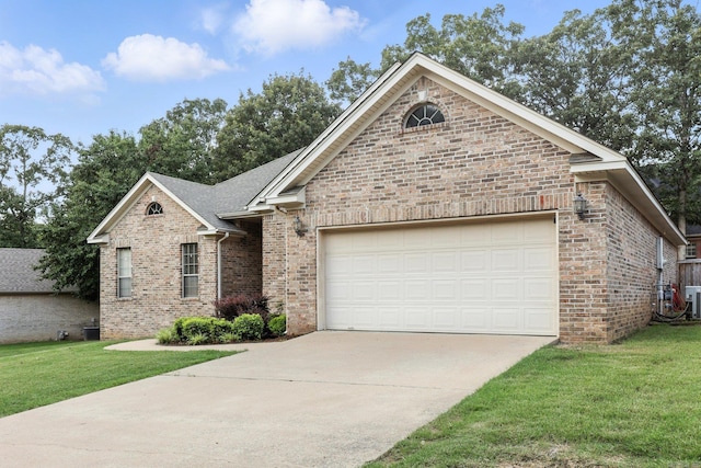 7328 W Ridge Cir, Sherwood, AR 72120 - view of front of property with brick siding, concrete driveway, a garage, and a front yard